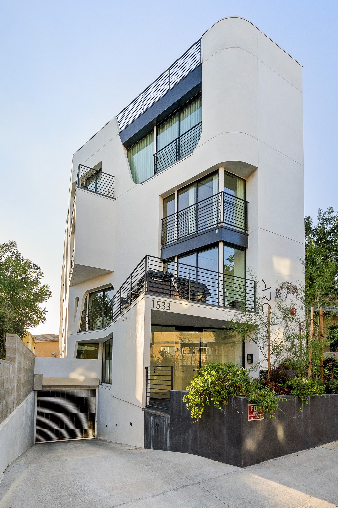White-walled house with black balconies and railings. California, USA